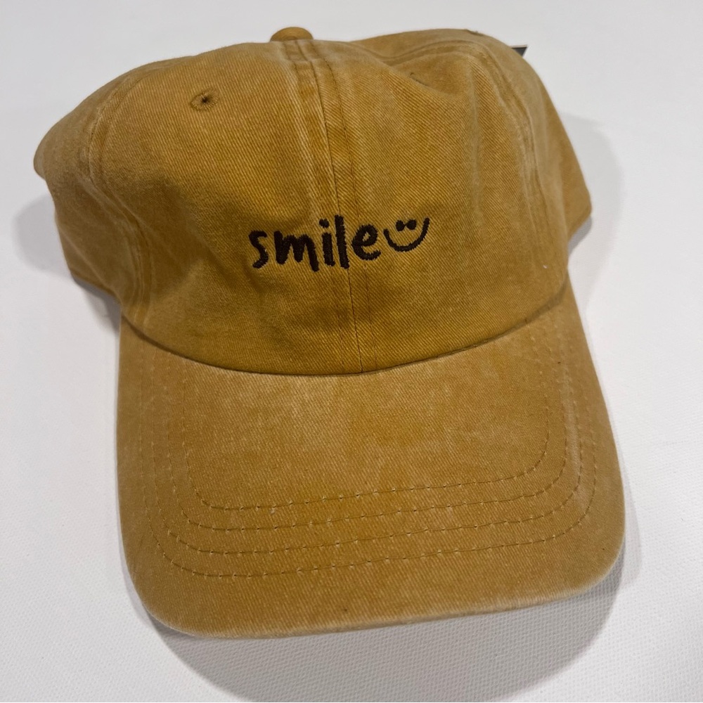 Embroidered Smile Logo on the front , Adjustable Strapback with buckle